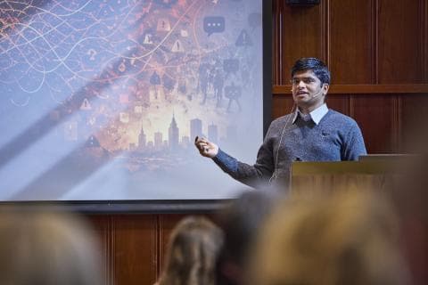 Sushant Gautam presenting on stage