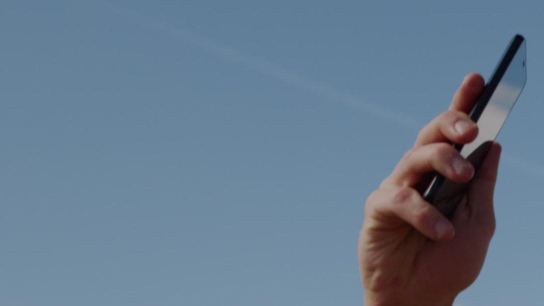 Stock photo of searching for signal with smart phone